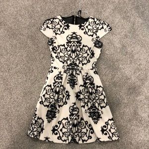 cream and black dress with mesh back